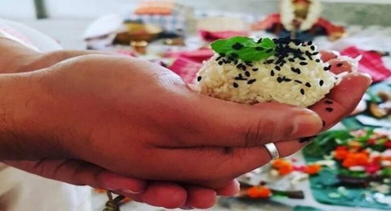 handful of rice and leaves as an offering (a part of the Pitru Paksh Ritual)